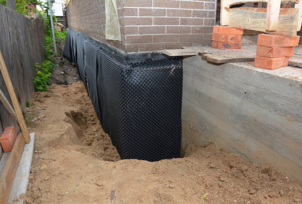 Happy homeowners after waterproofing job in Wayzata